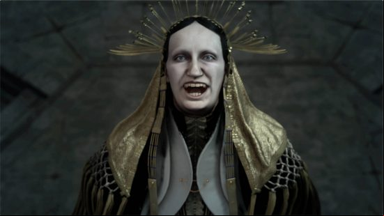 Forspoken cast voice actors - Tanta Prav is a pale-skinned woman dressed in an ornate headdress with robes.