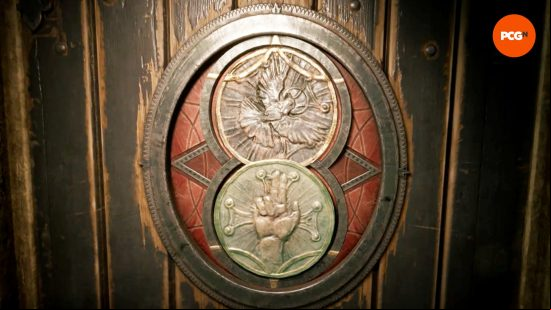 Two medallions are arranged in the Alone in the Dark crypt gate.
