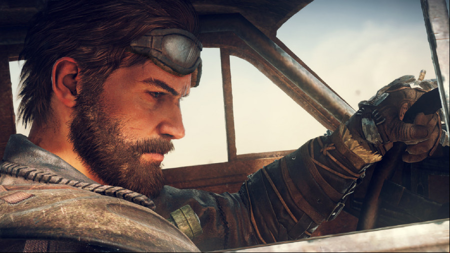 Mad Max - The bearded protagonist sits in his car.