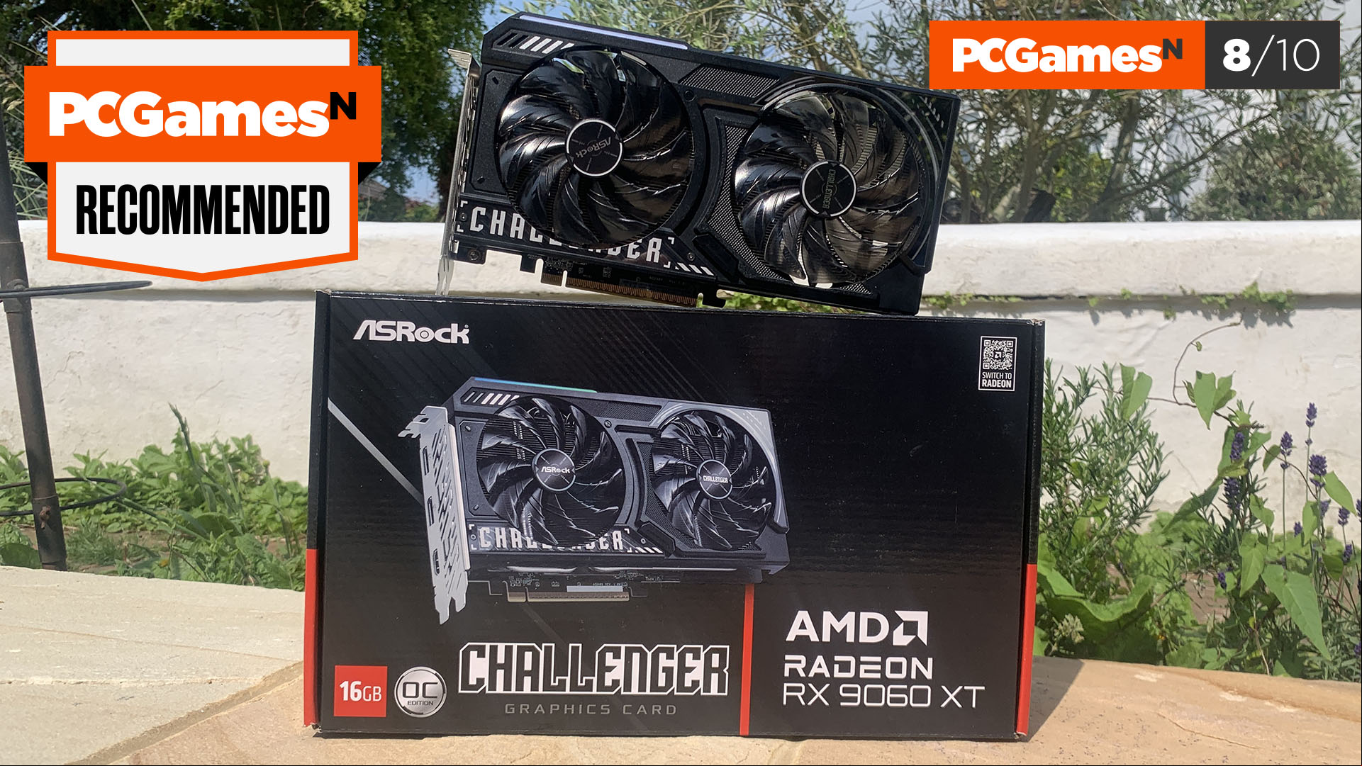 AMD Radeon RX 9060 XT review: ASRock Challenger OX graphics card with box, score, and award.